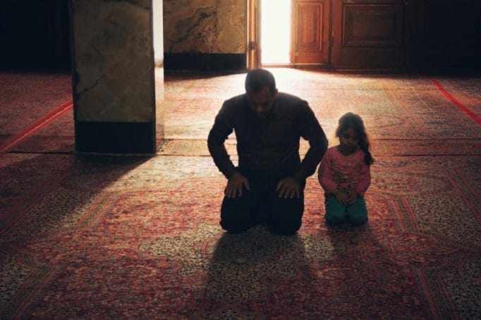 Father and Child Kneeling prayer